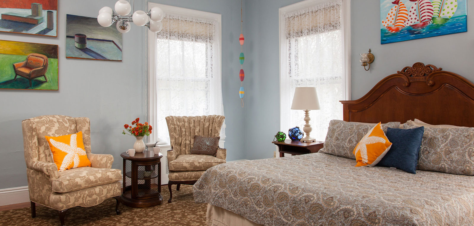 King Private Bath Bedroom Room with Paintings | ADMIRAL SIMS B&B, Newport Rhode Island
